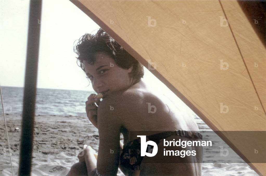 Bernadette Lafont, as a young woman, on the beach, south of France, c. 1955 (photo)