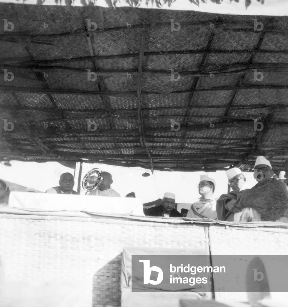 Sardar Vallabhbhai Patel, Mahatma Gandhi, Bhulabhai Desai, Subhash Chandra Bose and others on dais a public meeting, 1939 (b/w photo)