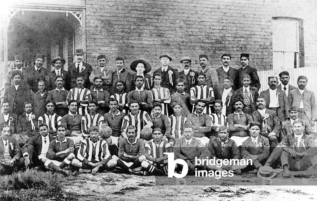 Mohandas Gandhi with a football team of passive resisters in South Africa, 1913 (b/w photo)