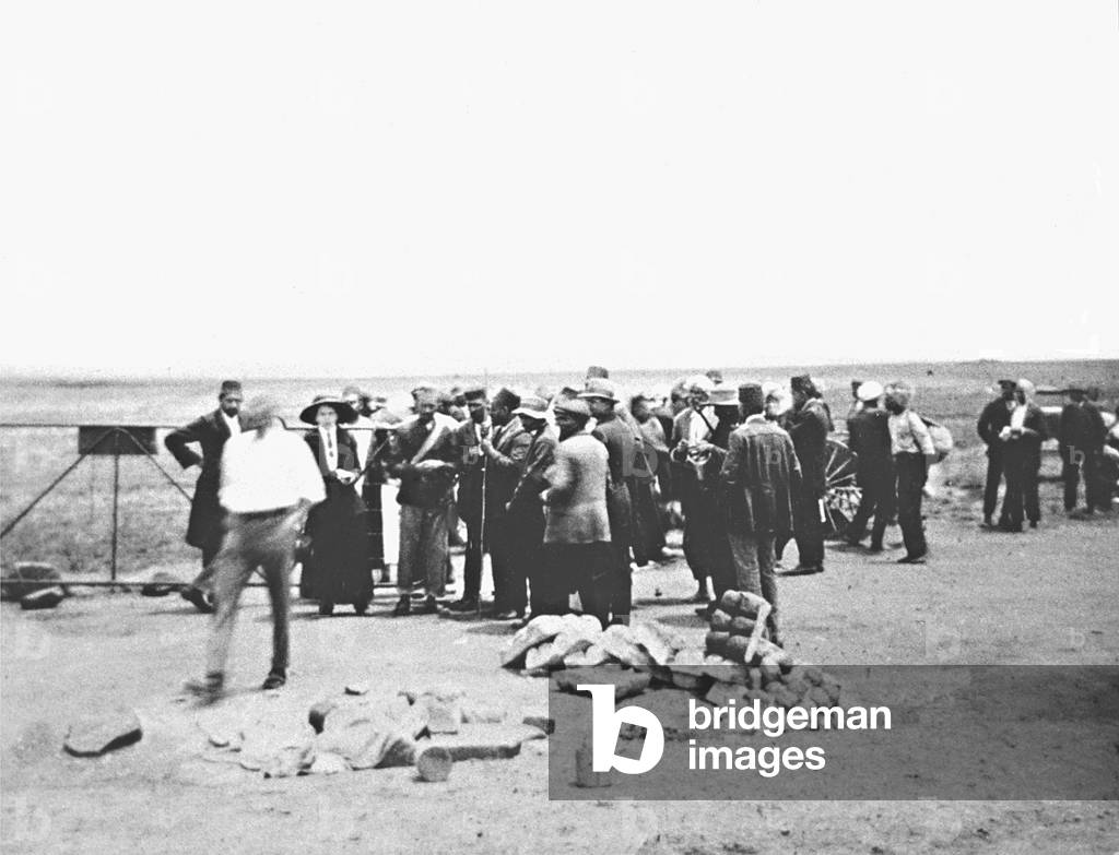 Striking Indian mineworkers, led by Mahatma Gandhi, during their march from Newcastle to the Transvaal, South Africa, November 6, 1913 (b/w photo)