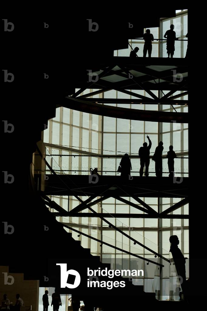 Silhouettes of people in the Museum of Islamic Art, Doha, Qatar (photo)