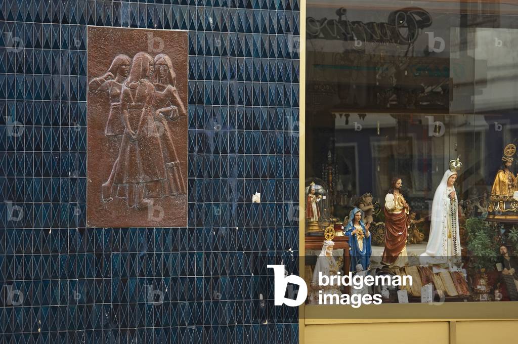 Portugal, Azores, Sao Miguel Island, View of shop with religious items and tile relief, Ponta Delgada (photo)