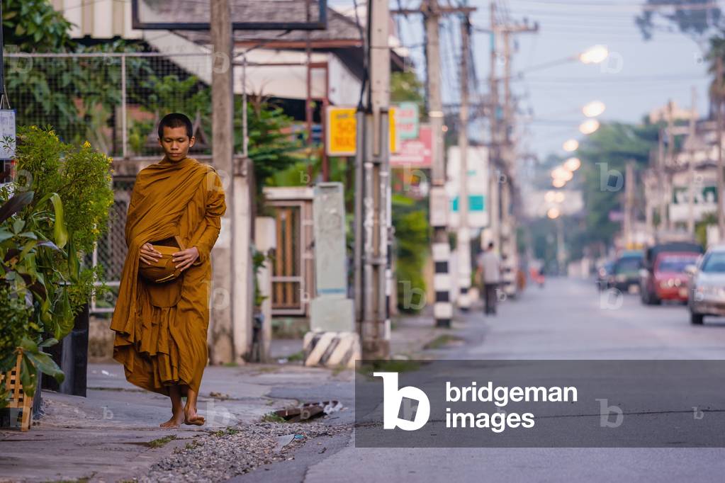 Monk walking down street, Chiang Mai, Thailand (photo)