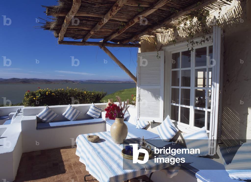 Table on Patio Outside House Near Coast (photo)