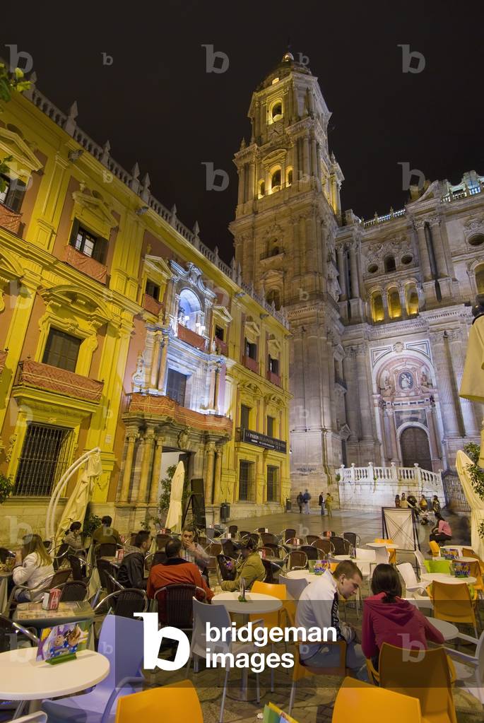 People at Cafe Tables in Square in Front of Cathedral  and Palacio Episcopal at Night, Malaga, Andalucia, Spain (photo)