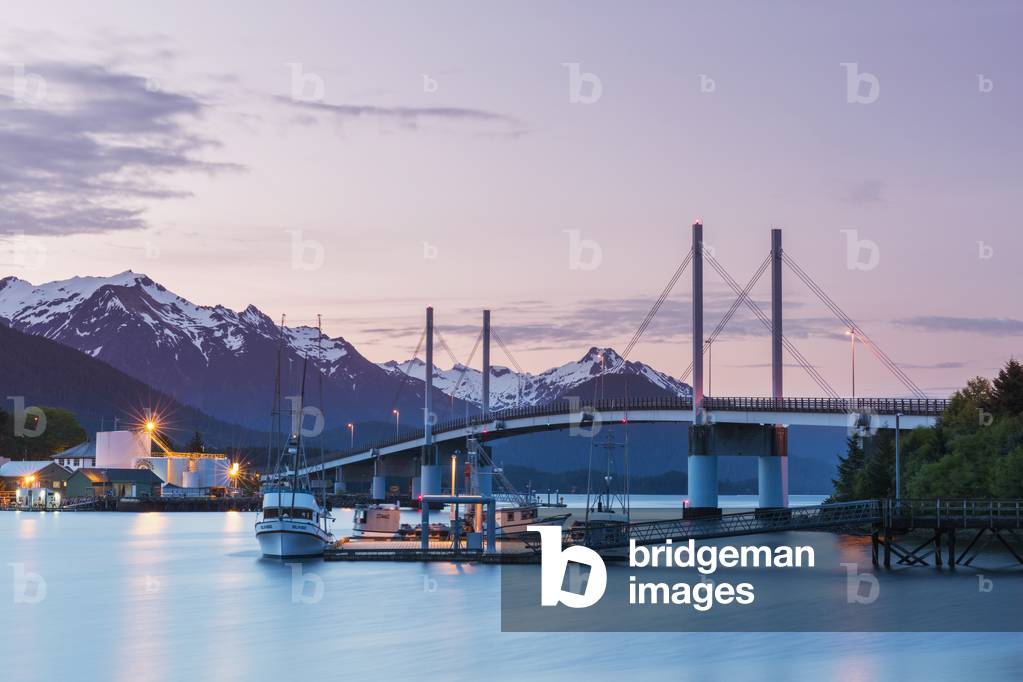 Fishing boat moored along the pier in Sitka Harbor with O'Connell Bridge and the mountains in the background at twilight, Southeast Alaska, USA, Summer (photo)