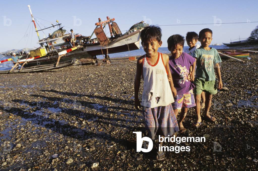 Children on Rocky Beach, Bais, Negros Island, Philippines (photo)