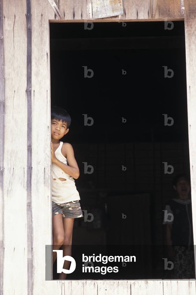 Child Looking From Doorway (photo)