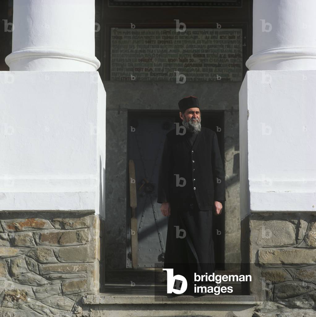 Monk in Doorway of Monastery (photo)