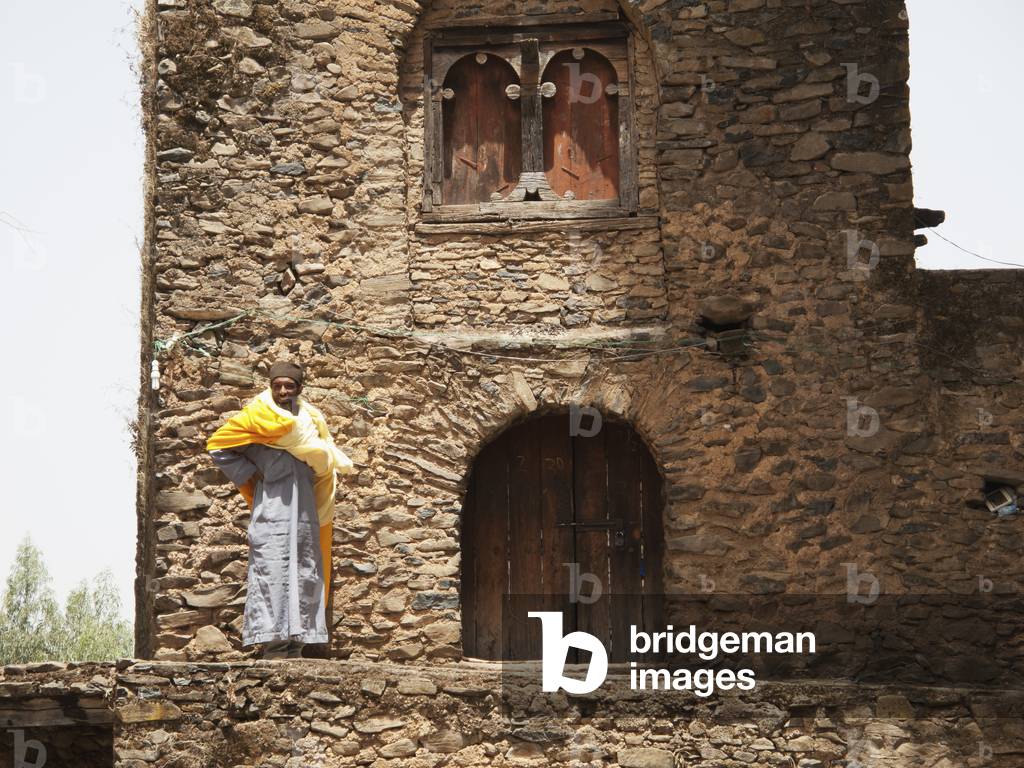 Churchman at gateway, Debre Birhan Selassie church, Gondar, Amhara region, Ethiopia (photo)