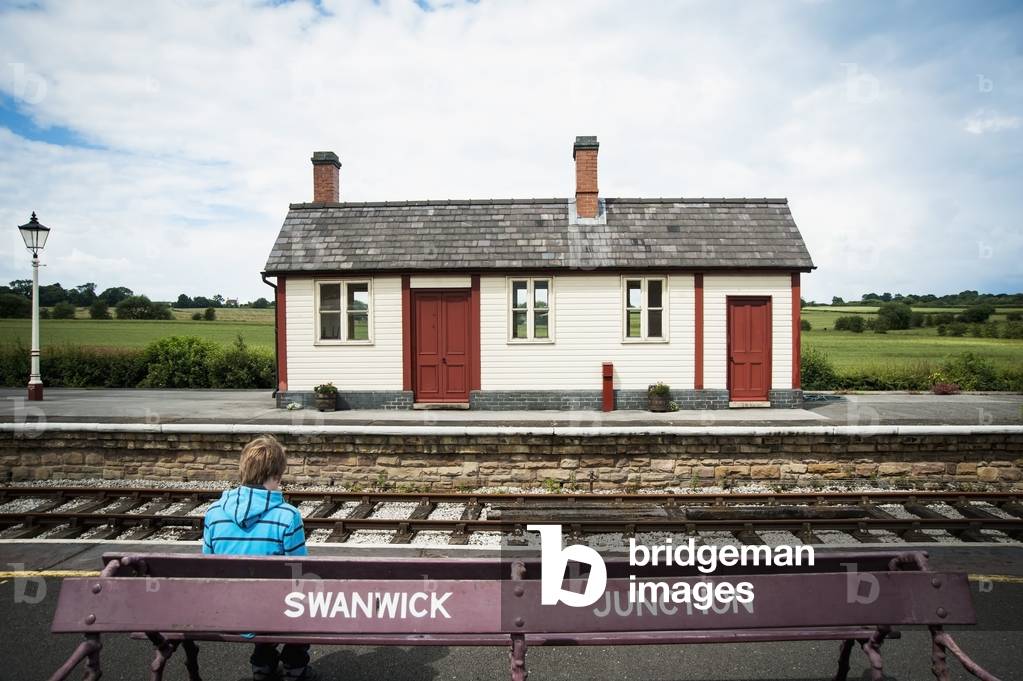 UK, England, UK , Midland Railway, Derbyshire, Boy waiting at Swanwick Junction (photo)