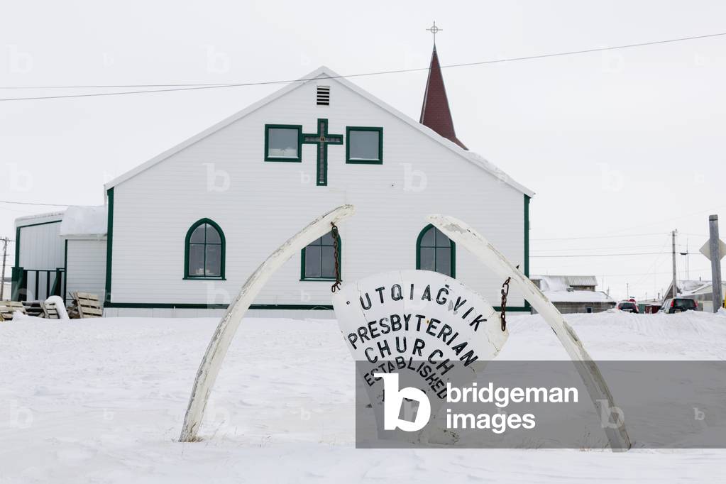 Utqiagvik Presbyterian Church with a whale bone sign in the foreground, Barrow, North Slope, Arctic Alaska, USA, Winter (photo)