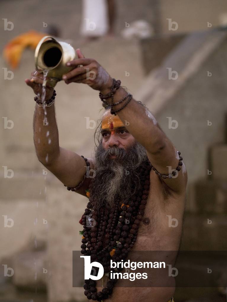 The Ganges River, Varanasi, India, a Sadhu Pouring Libations Into the Ganges (photo)