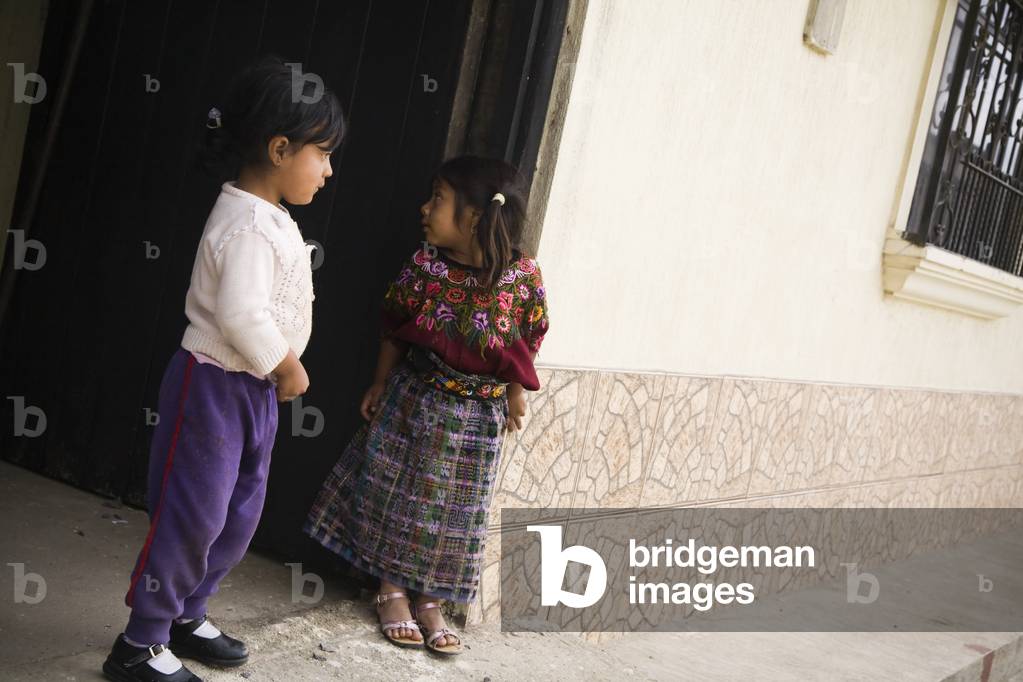 Patzicia, Guatemala, Central America, two Girls Standing on Sidewalk (photo)