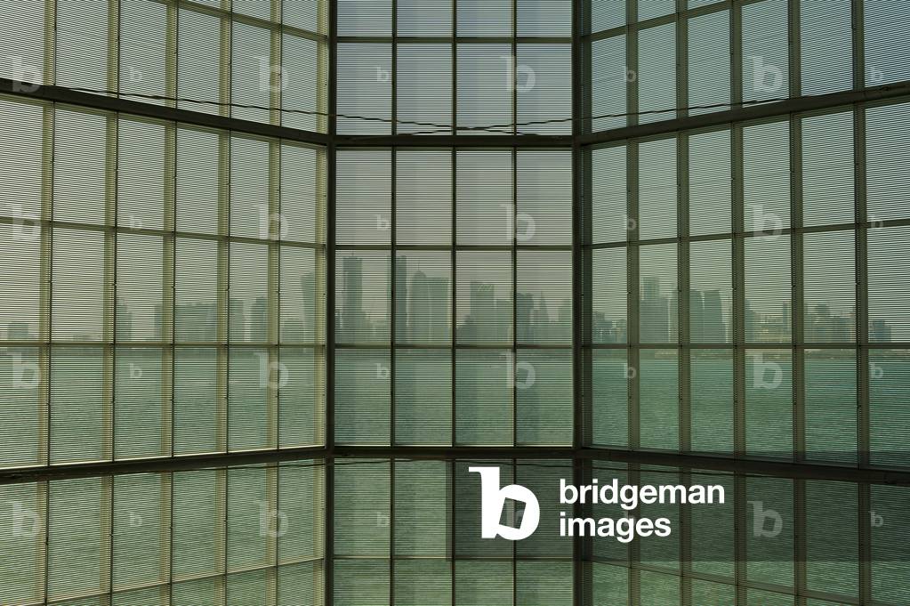 View out of large window in the Museum of Islamic Art to the modern city skyline of Doha, Doha, Qatar (photo)