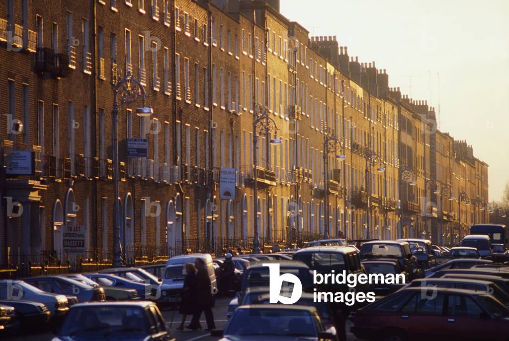 A Traffic Jam By Terraced Buildings (photo)