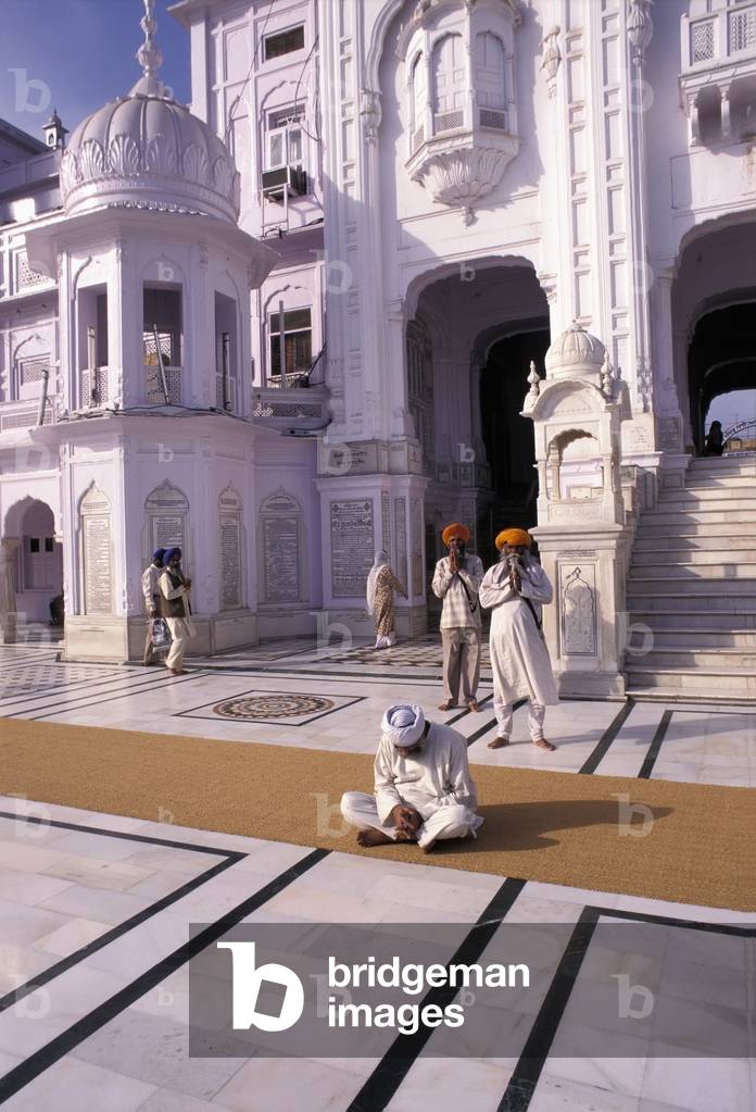 Man Sitting on a Rug, Golden Temple, Armritsar, Punjab, India (photo)