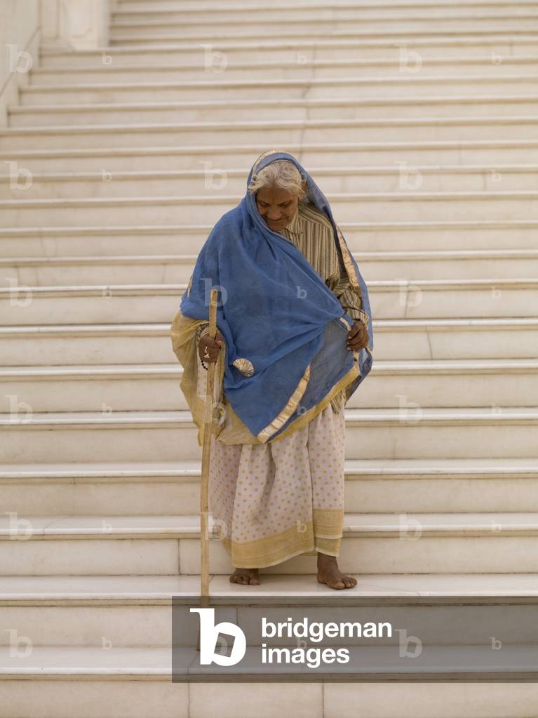 Senior Woman on Stairs with walking Stick, Agra, India (photo)
