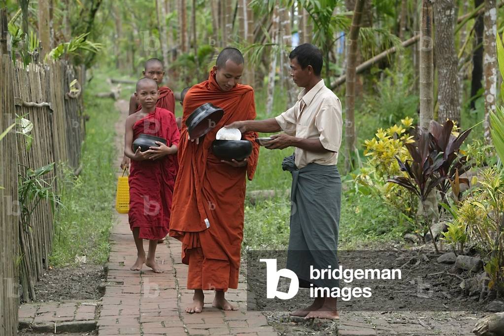 Buddhist Monks Receiving Alms from Villager, Ayeyarwady River Delta, Myanmar, Ayeyarwady, Burma (photo)
