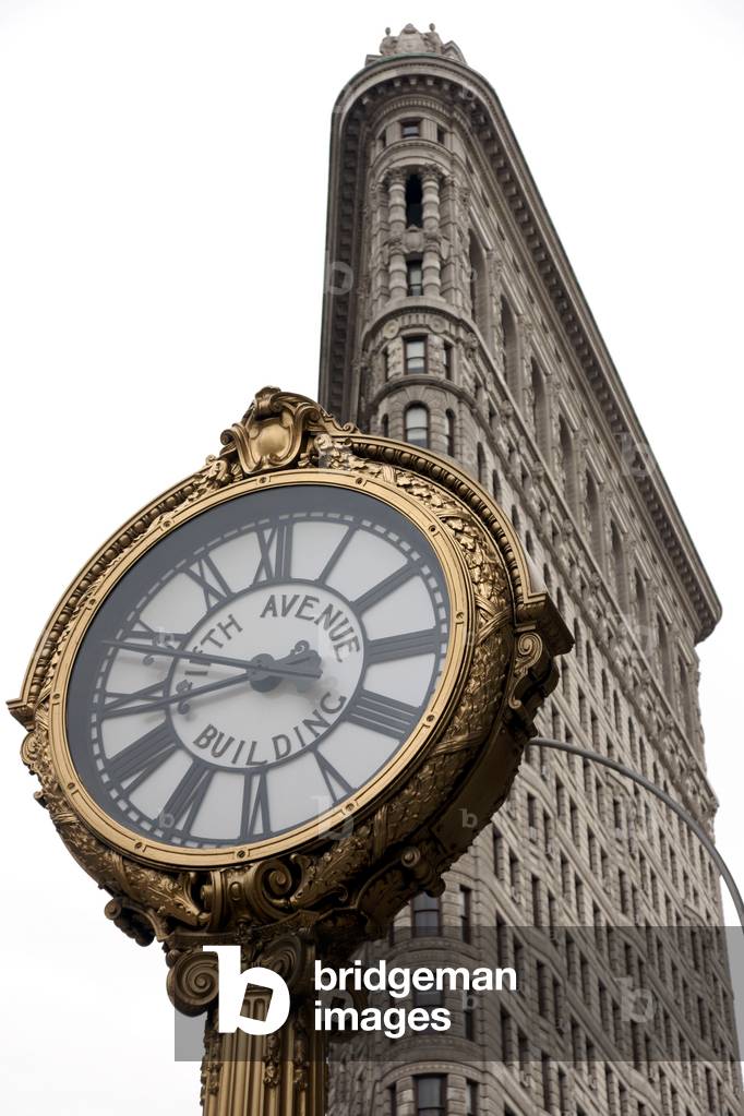 The iconic Flatiron Building and the 5th Avenue Clock, Midtown Manhattan, New York City, New York, USA (photo)