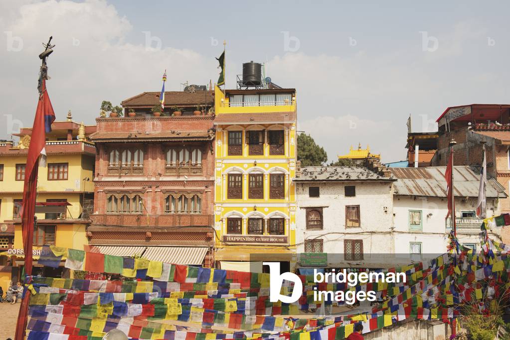 Buildings and prayer flags on the main square, Boudhanath, Nepal (photo)