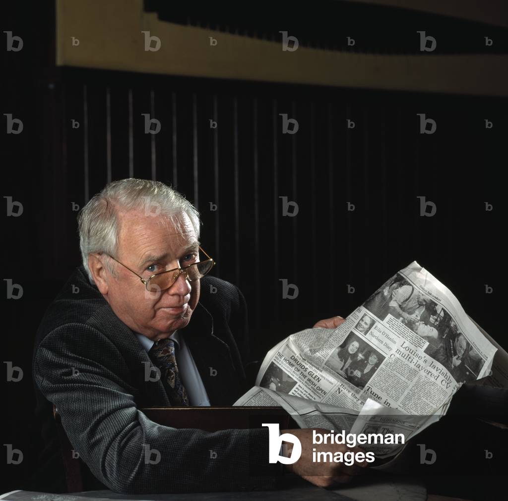 Senior Man Reading Newspaper (photo)