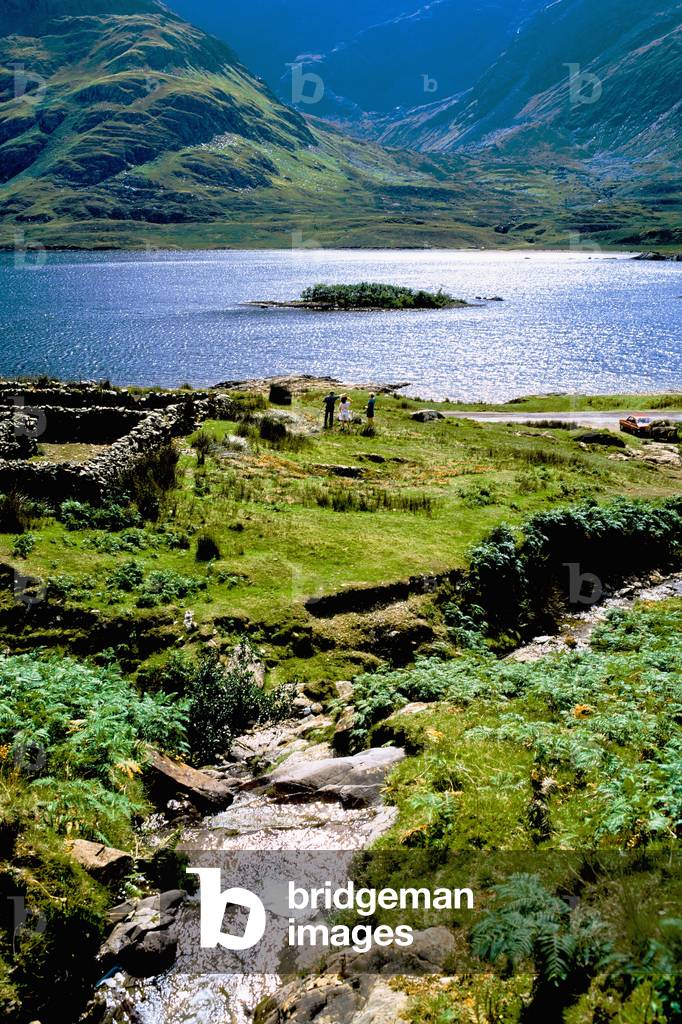 Doo Lough, Co Mayo, Ireland; Tourists By An Old Cottage Ruin (photo)