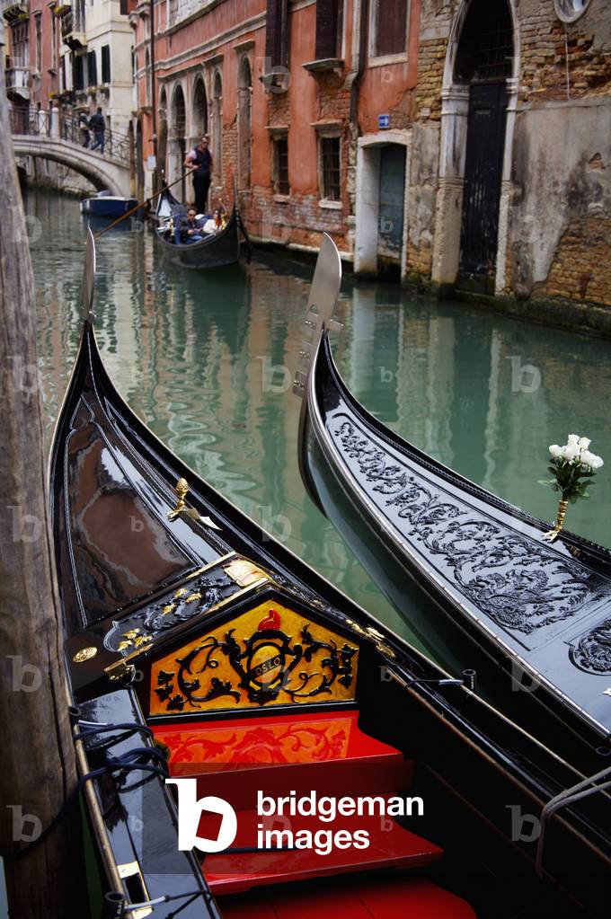 Gondolas in a canal, Venice, Italy (photo)