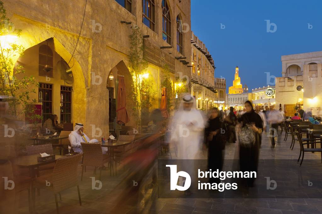 Qatar, People walking through Wafi souk at dusk, Doha (photo)