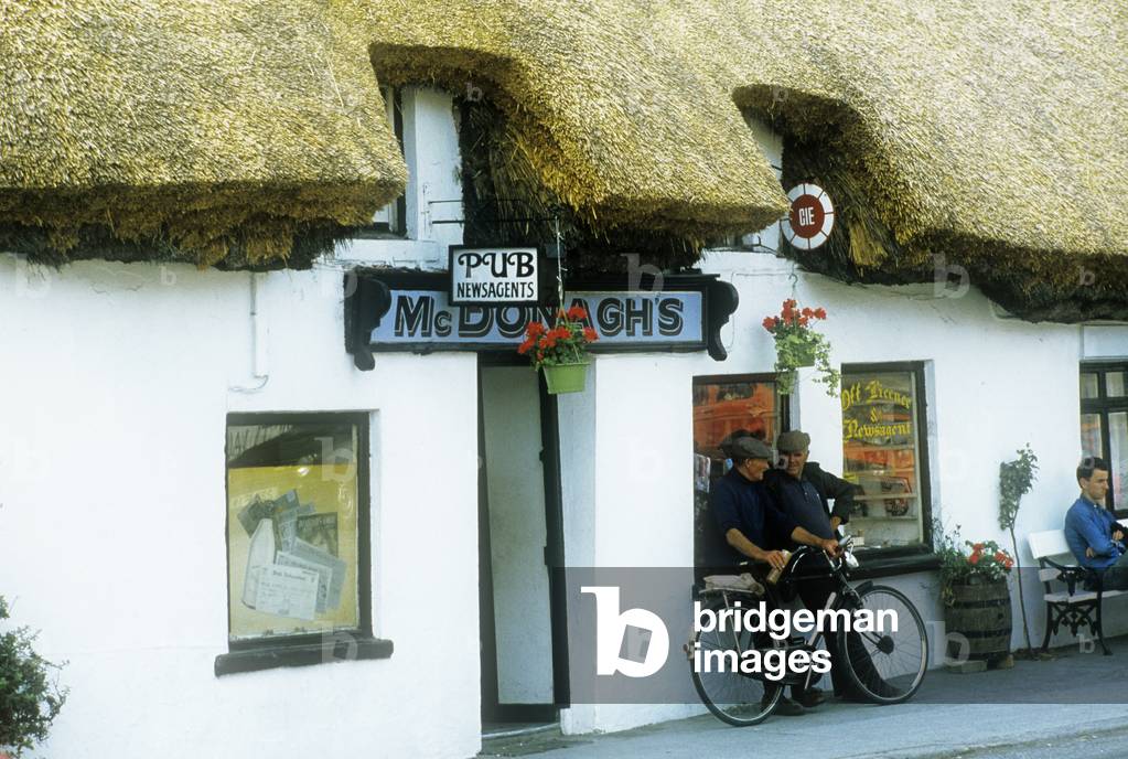Mcdonough's Pub, Oranmore, Co Galway, Ireland; Three Men Outside Of A Pub (photo)