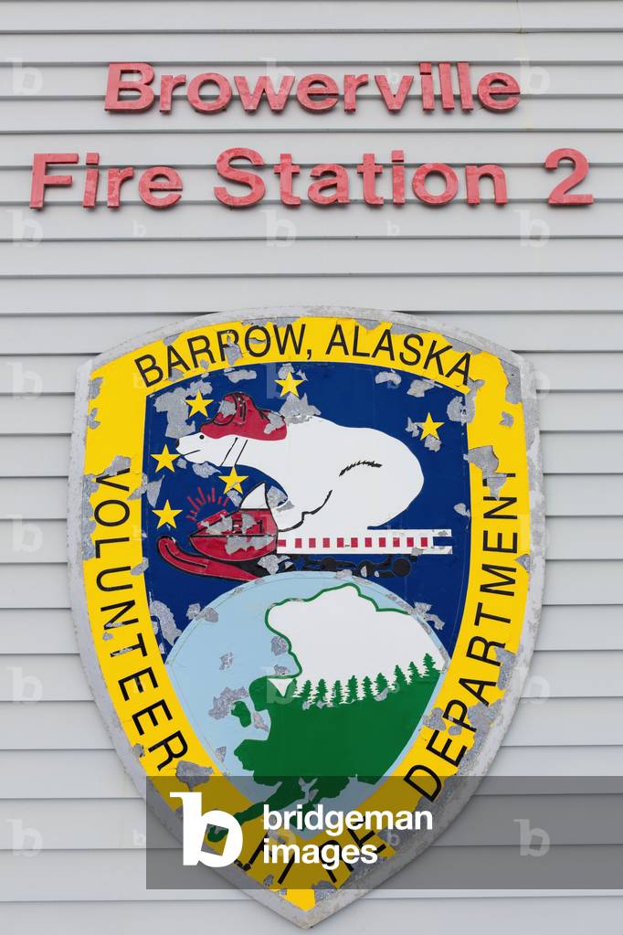 Exterior view of the badge and lettering on the wall of the Browerville Fire Station, Barrow, North Slope, Arctic Alaska, USA, Winter (photo)