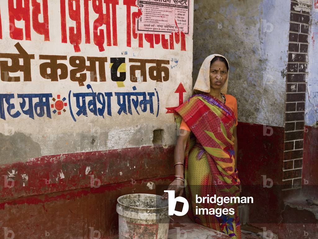 Varanasi, India, Portrait of a Woman outside a Shop Front (photo)