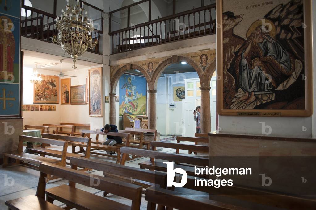 A man prays inside the Greek Orthodox Church of St. George, Madaba, Jordan (photo)