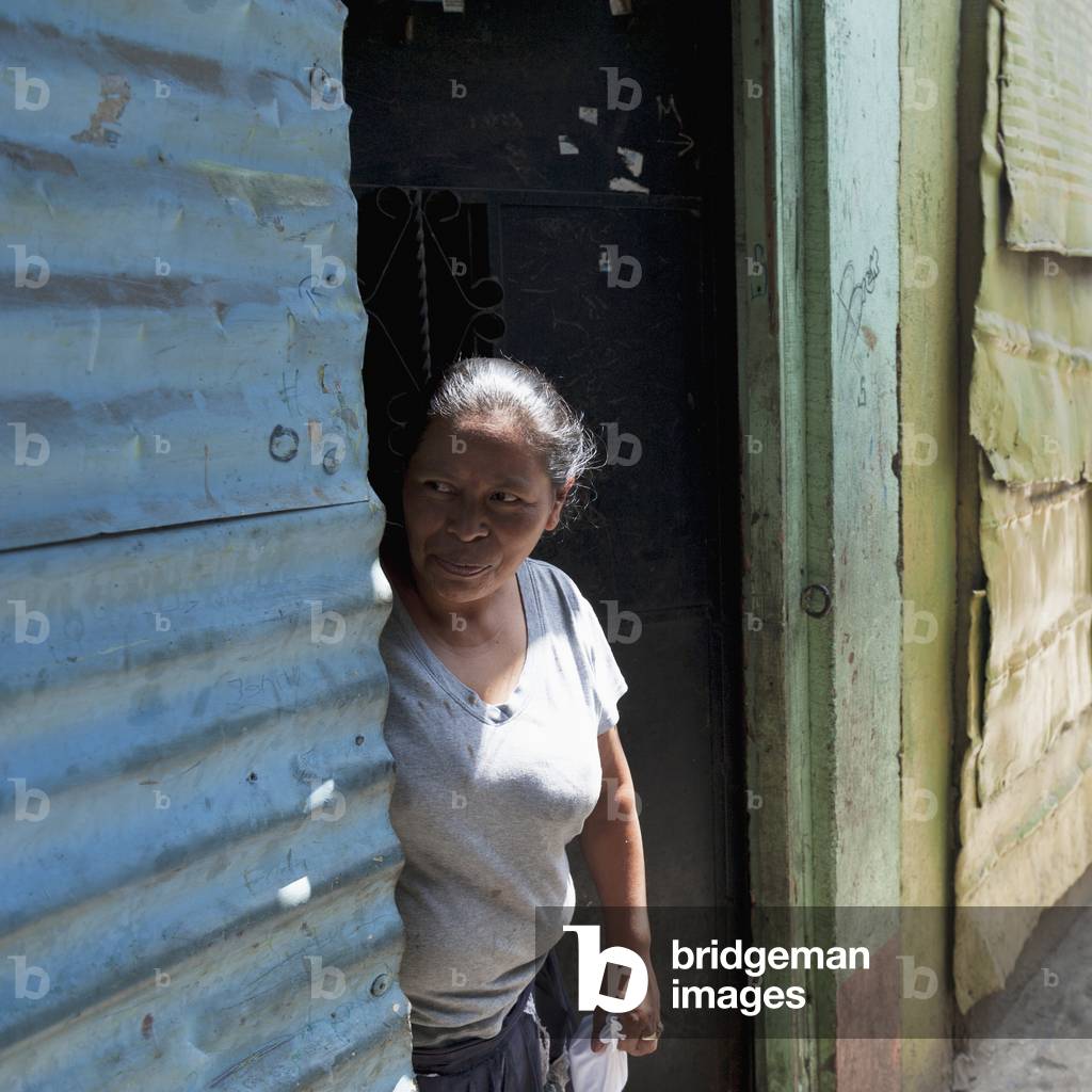 A Woman Standing in a Doorway, Guatemala City Guatemala (photo)
