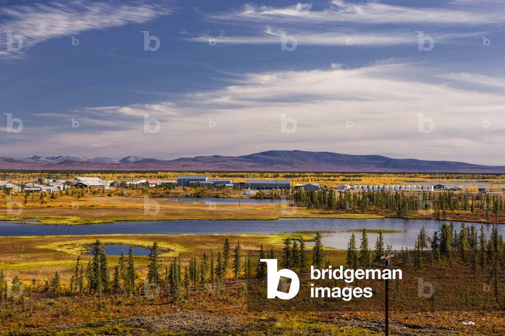 Scenic view of the village of Noatak and the surrounding wetlands, tundra, and Baird Mountains in the distance, Arctic Alaska, Summer (photo)