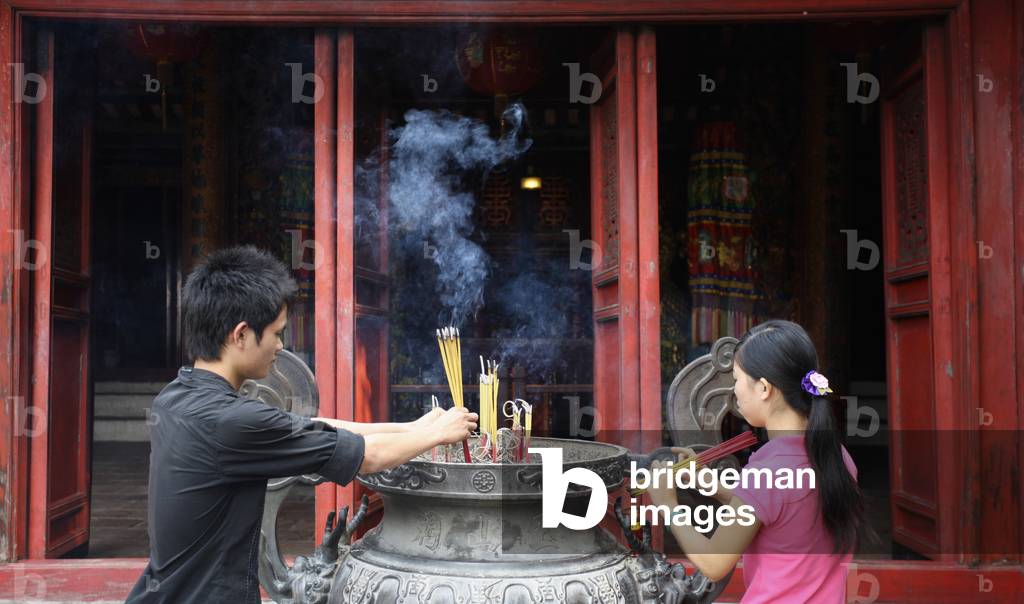 Vietnam, Incense sticks in City Tepmle, Hanoi (photo)