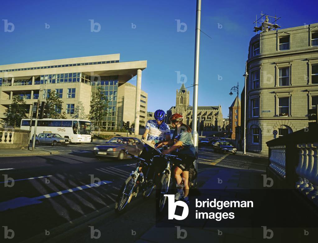 Dublin,Co Dublin,Ireland;Cyclists Consulting A Map On A Bridge (photo)