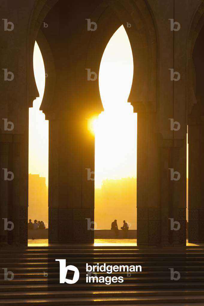 Morocco, Looking through arches of Hassan II mosque at dusk, Casablanca (photo)