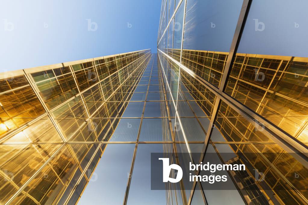 Reflections on the exterior glass of the Conoco Phillips building on a clear sunny day, downtown Anchorage, Southcentral Alaska, USA, Summer (photo)