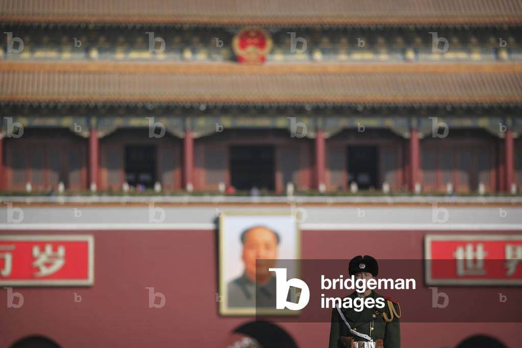 Beneath The Portrait of Chairman Mao Zedong, Chinese Soldiers Keep Guard Outside The Forbidden City, Tiananmen Square, Beijing, China (photo)