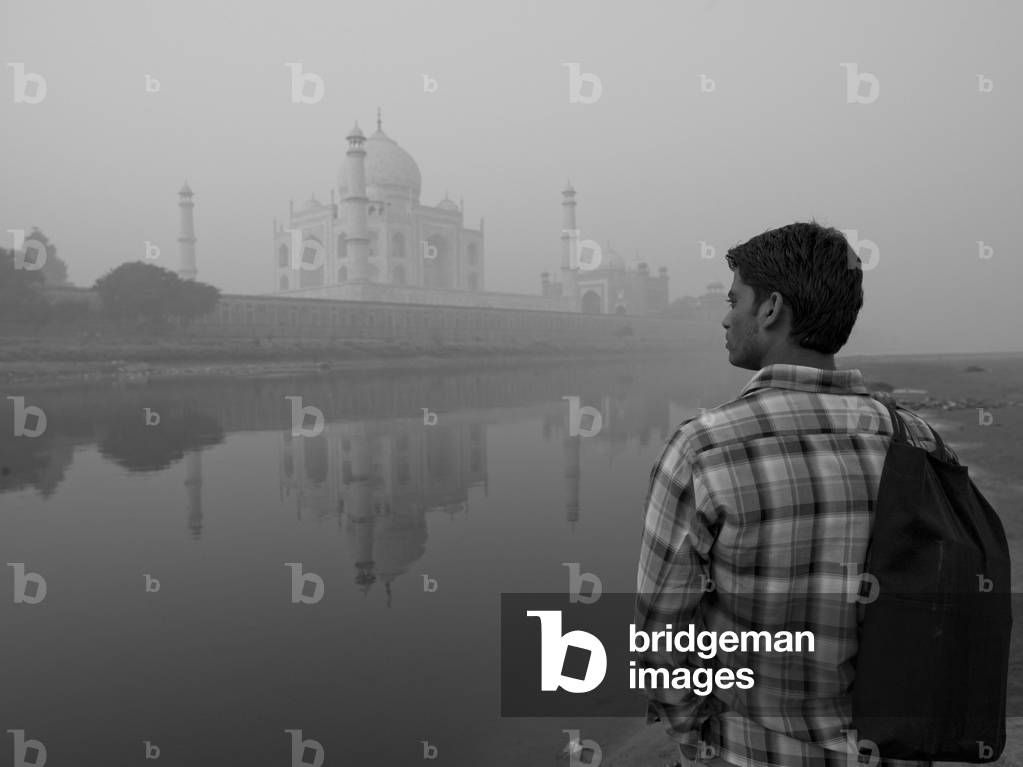 Taj Mahal, Agra, India, Young Man Standing At Water's Edge, looking At the Taj Mahal (photo)