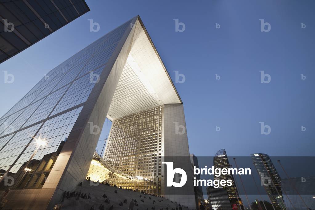Low angle view of buildings illuminated at dusk, Paris, France (photo)