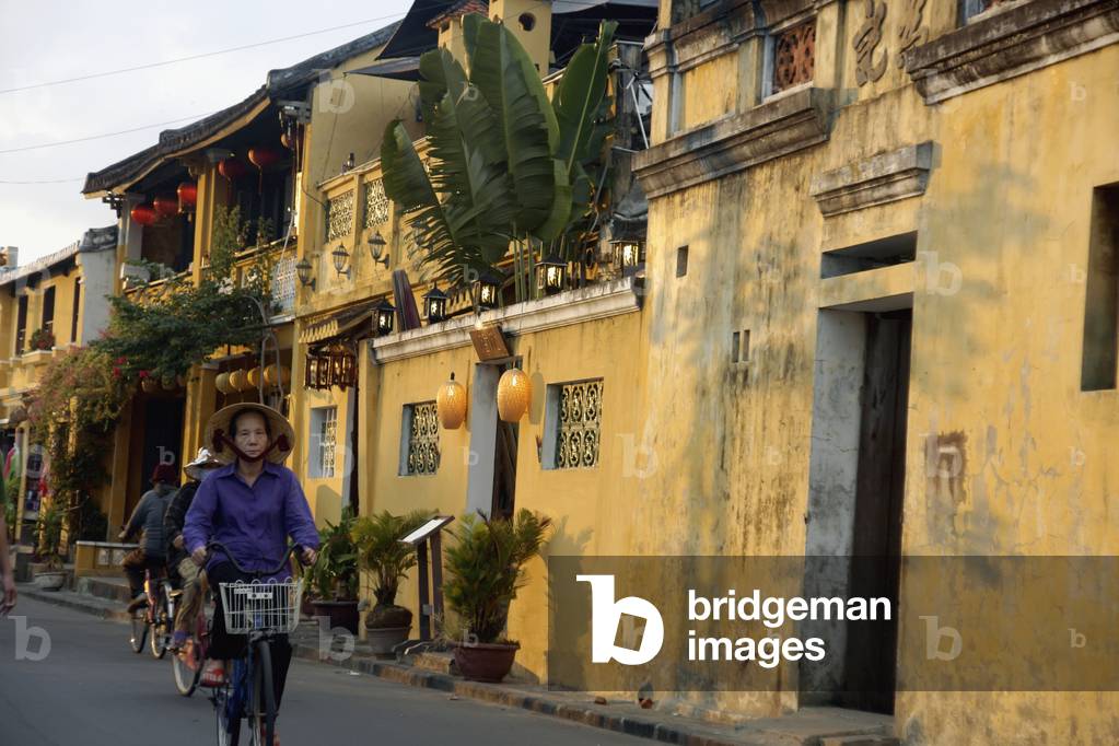 French Colonial Style Houses at Sunset in Historic Town of Hoi An, Vietnam (photo)