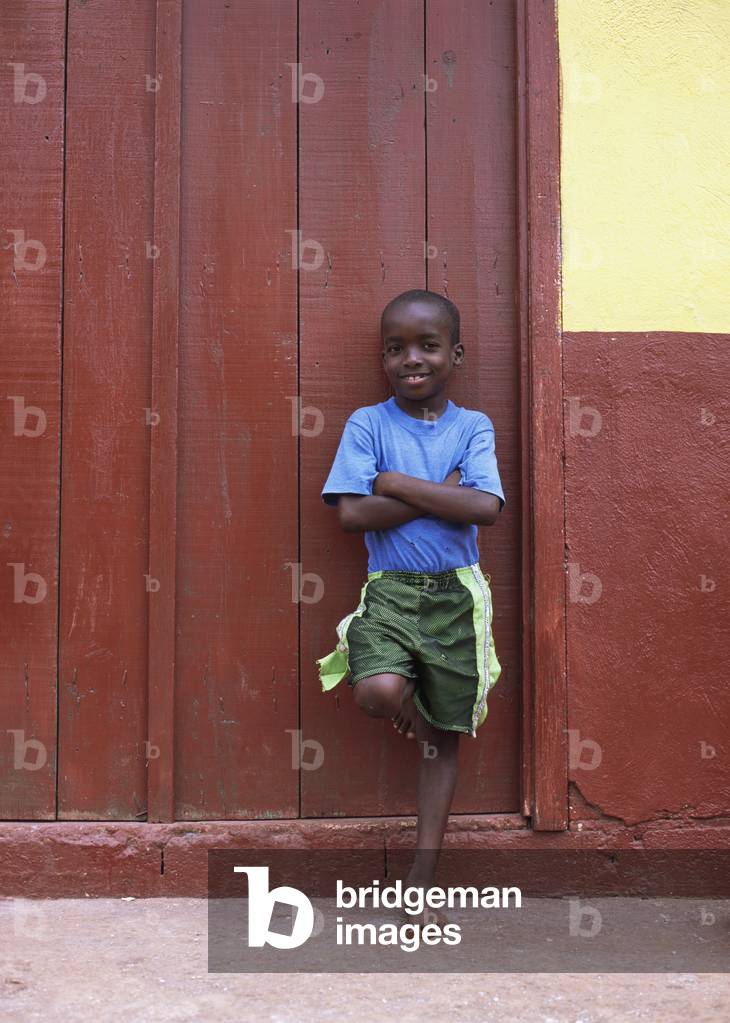 Young Boy Outside His House (photo)