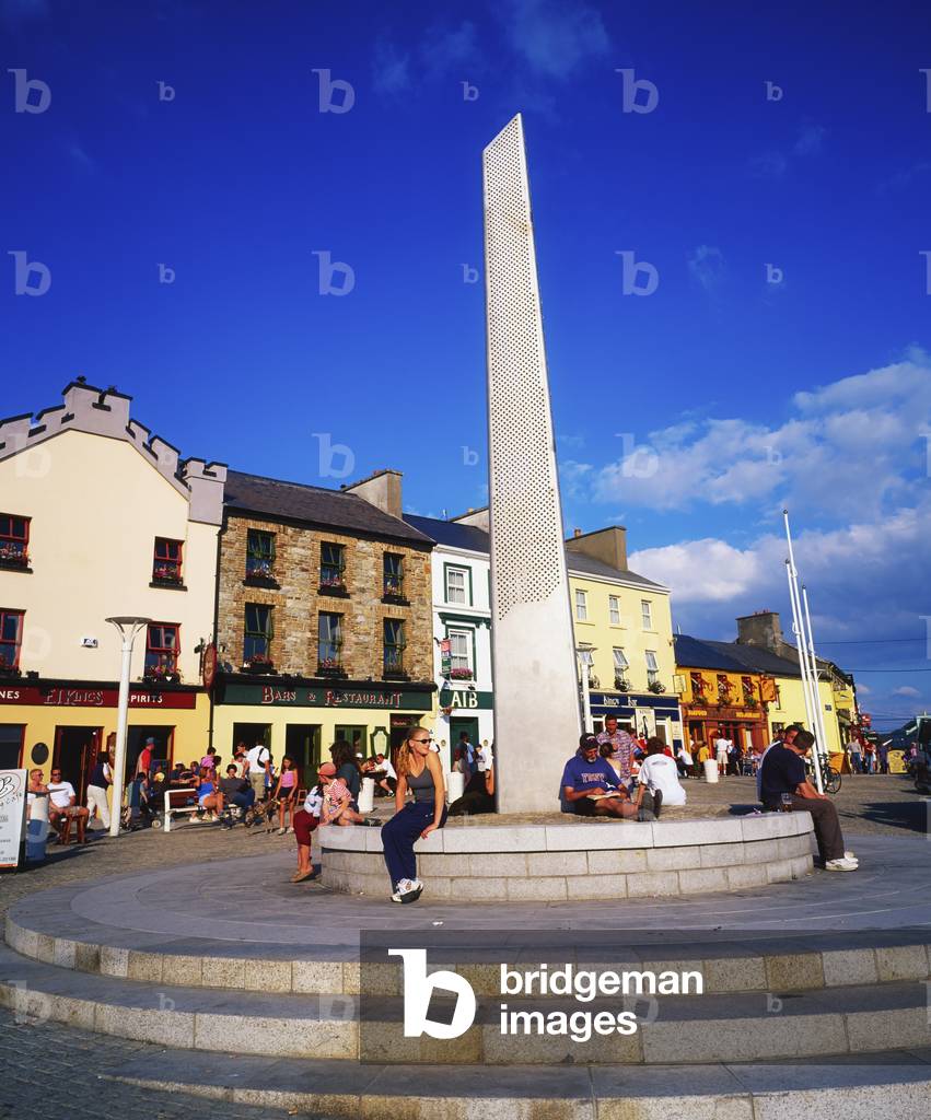 Connemara,Co Galway,Ireland;People Sitting By A Sculpture In The Clifden Town Centre (photo)