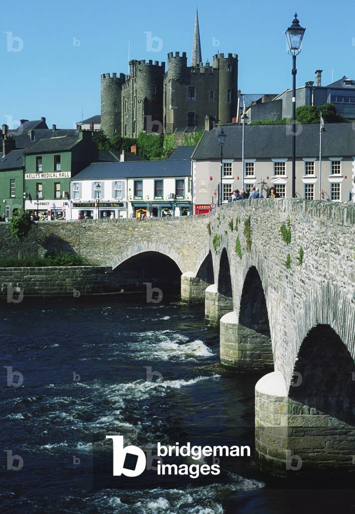 Ireland; Castle And Bridge In A Village (photo)