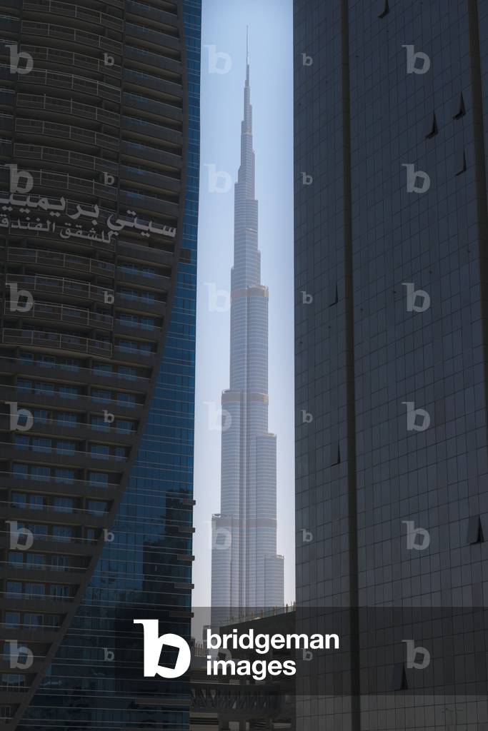 Looking between two tall office buildings to the Burj Khalifa, Dubai, United Arab Emirates (photo)