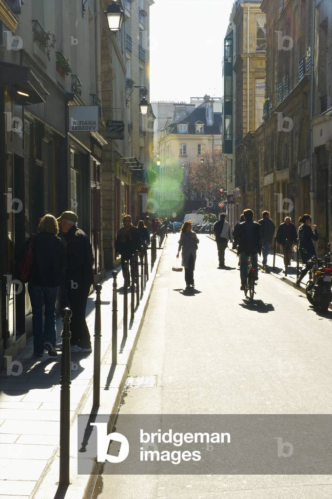 Pedestrians walking in Marais district, Paris, France (photo)