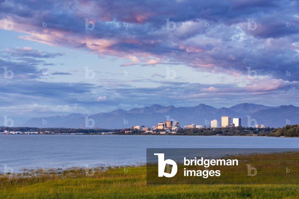 View of downtown Anchorage during an atmospheric sunset as seen from Earthquake Park, Anchorage, Southcentral Alaska, USA, Summer (photo)