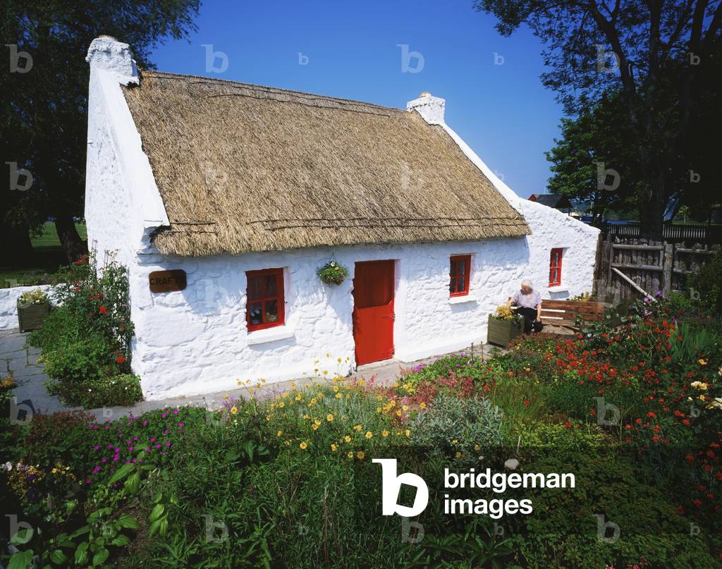 Dromineer, County Tipperary, Ireland; Traditional Thatch Roof Cottage (photo)